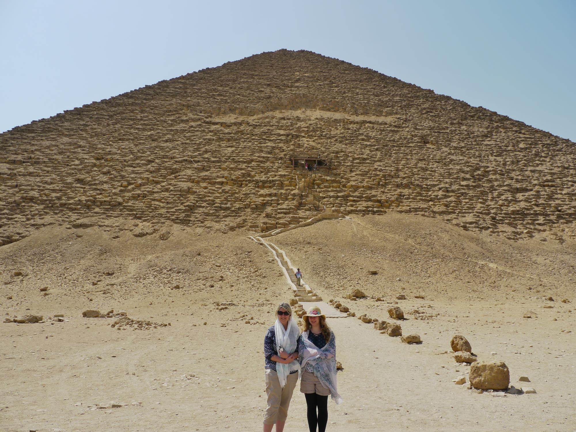 The Red Pyramid, also by Sneferu, was Egypt's first smooth-sided pyramid. Some believe Sneferu's tomb is still hidden inside. We looked inside but couldn't find it 