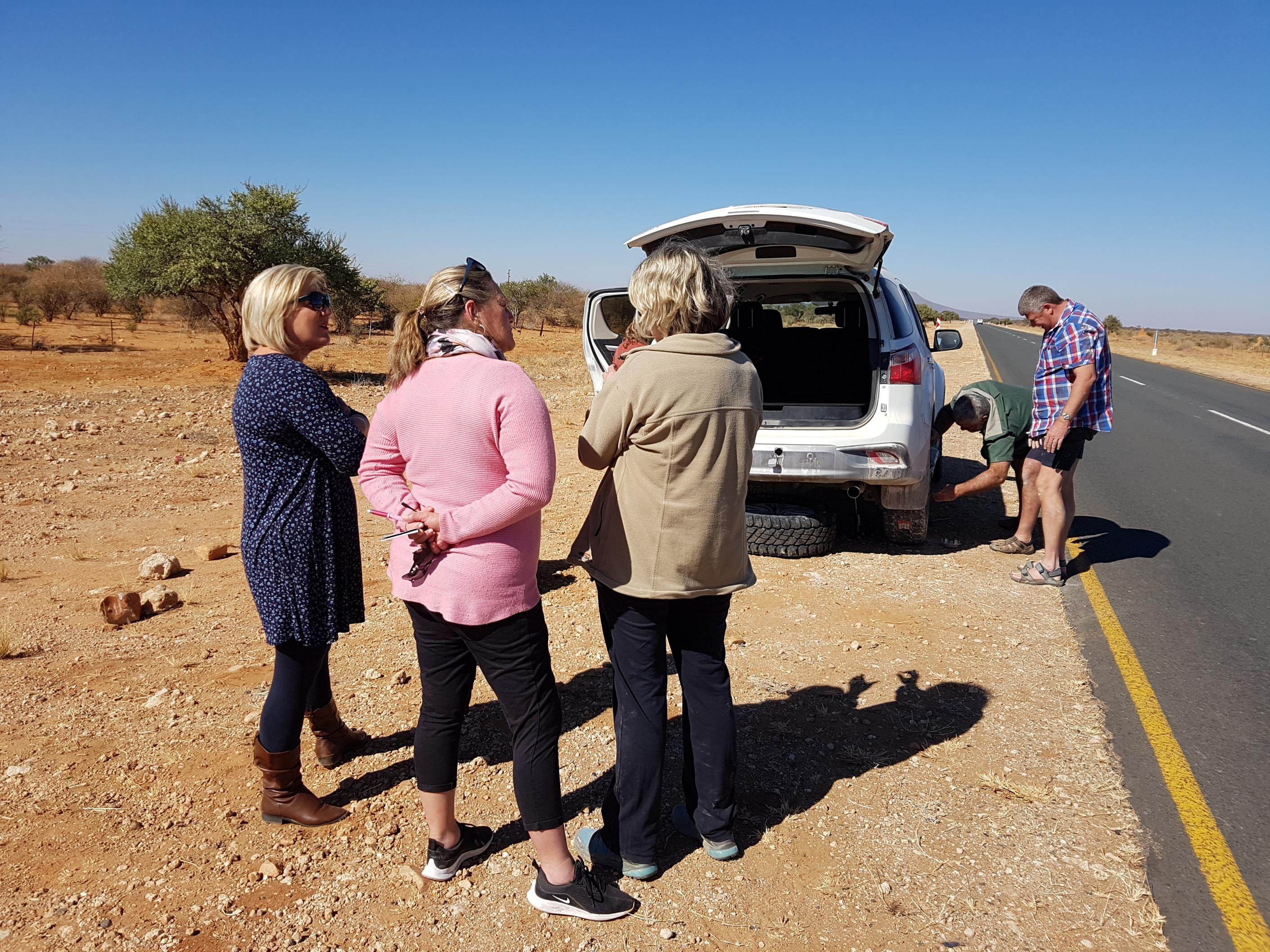 Better to get a flat tyre on the way to the airport than in Etosha with the lions. We were grateful for help from passersby