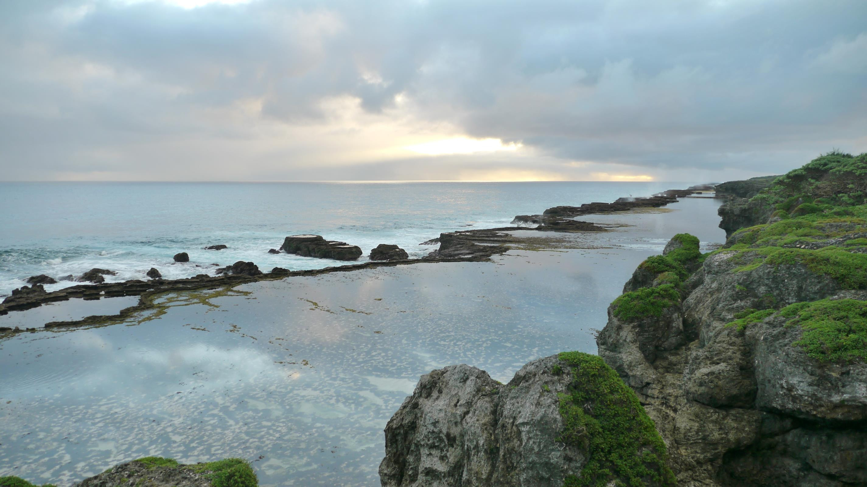Coastal terraces form enormous natural infinity pools along the Tongatapu coast